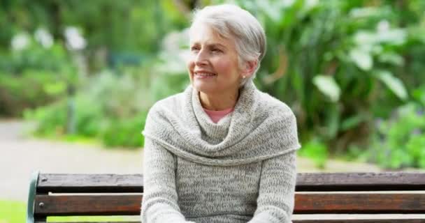 Senior Woman Suffering Chest Pain While Sitting Outdoors Park Bench — Vídeos de Stock