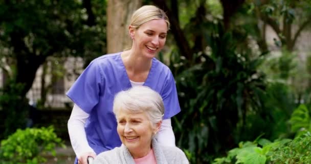 Loving Caring Nurse Assisting Disabled Senior Lady Wheelchair Garden Retirement — Vídeos de Stock