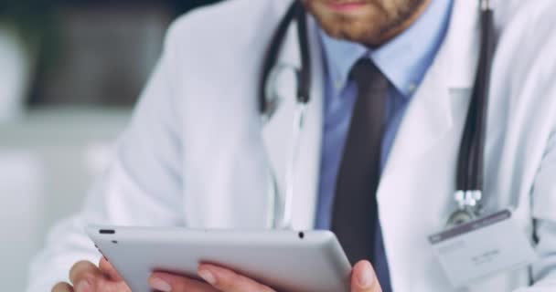 Serious Focused Thinking Doctor Typing Tablet His Office Using Internet — Video Stock