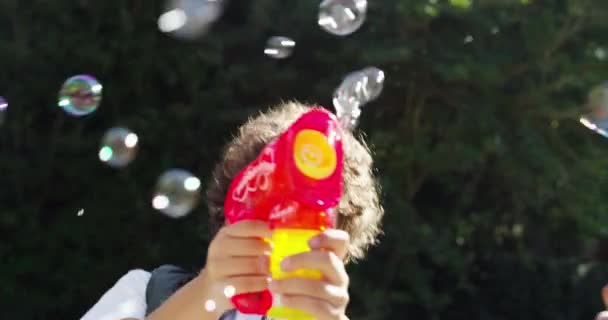 Bubbles Fun Play While Holding Toy Gun Enjoying Happy Childhood — Video