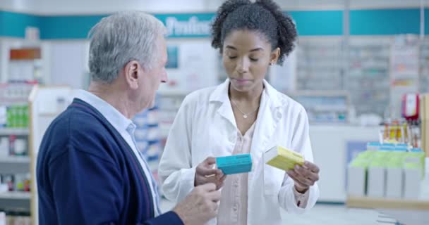 Friendly Helpful Experienced Pharmacist Assisting Senior Customer Medication Shelf Pharmacy — Video