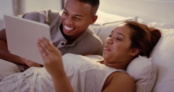 Laughing Cozy Couple Bonding Browsing Digital Tablet Bed Watching Online — Stockvideo