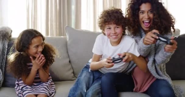 Joyful Siblings Mother Playing Video Games While Cheering Sofa Home — Vídeo de stock