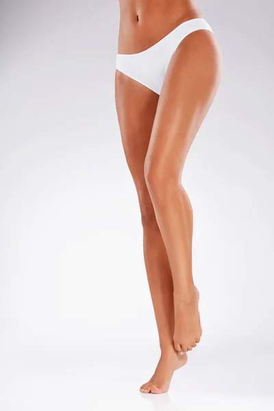 Smooth Silky Studio Shot Unrecognizable Young Womans Legs Gray Background — Fotografia de Stock