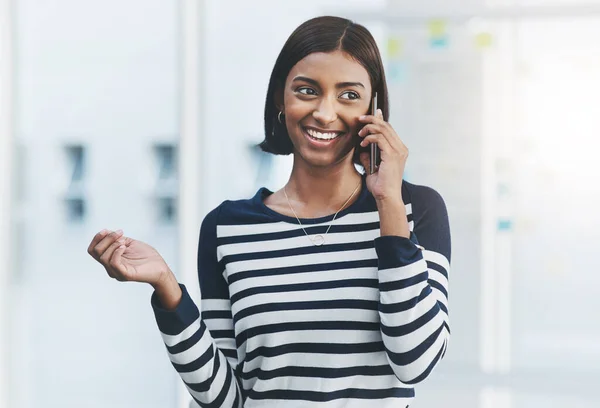 I look forward to further successful dealings with you. a young businesswoman making phone calls in her office