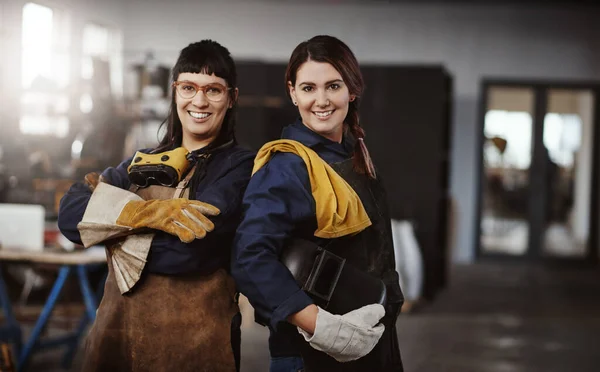 Metal work is our game. Cropped portrait of two attractive young female artisans standing in their workshop