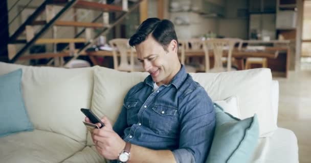 Young Man Browsing Phone While Relaxing Sofa Home Happy Guy — Stock video