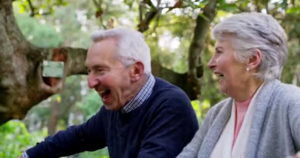 Happy Active Retired Senior Couple Enjoying Walk Bicycles Park While — Stockvideo