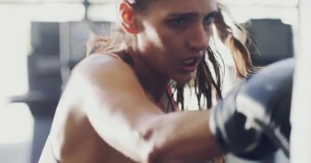 Fit Angry Aggressive Woman Punching Boxing Bag Gym Exercising Focused — Vídeo de stock