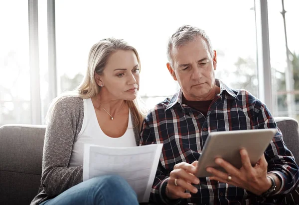 Finances Fine Mature Couple Using Digital Tablet While Going Paperwork —  Fotos de Stock