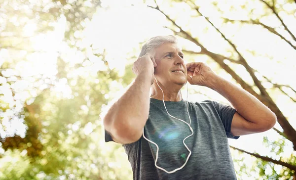Healthy Fit Active Senior Man Listening Music While Running Exercising — Stock Photo, Image
