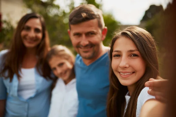 Family Fun Park Cropped Portrait Young Family Four Standing — Stock Photo, Image