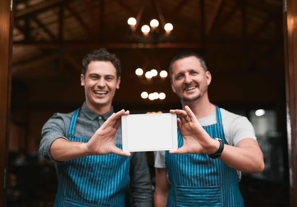 Turning Dream Reality Portrait Two Cheerful Businessmen Holding Digital Tablet — Stockfoto