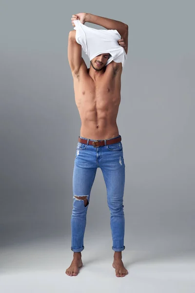 All Needs Jeans Studio Shot Handsome Young Man Undressing Grey — Zdjęcie stockowe