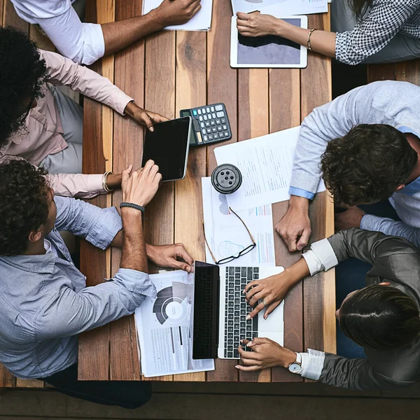 Planning, productivity and perseverance achieve success. High angle shot of a team of businesspeople having a meeting outside