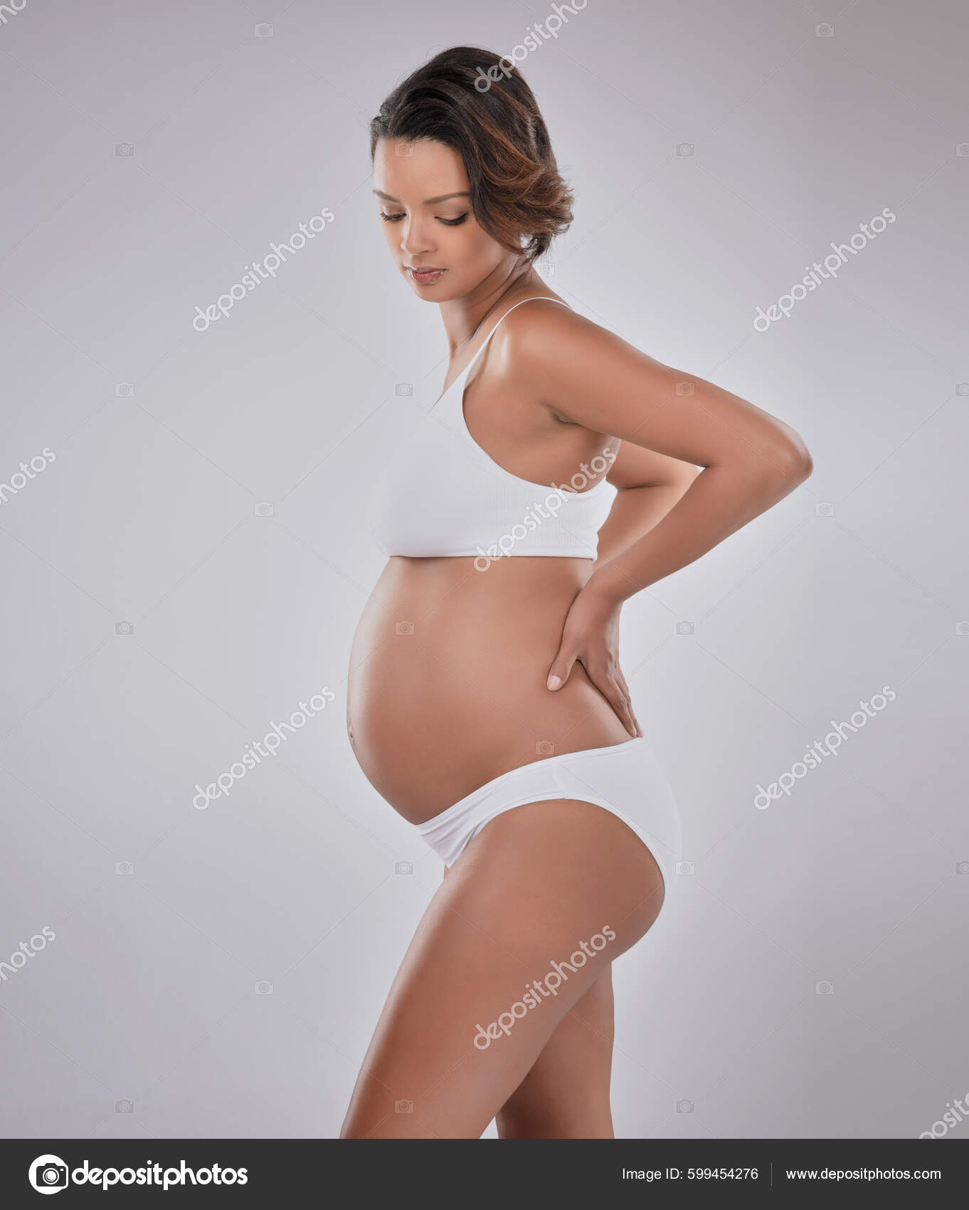 Whats Feeling Studio Shot Beautiful Young Pregnant Woman Posing Gray Stock  Photo by ©PeopleImages.com 599454276