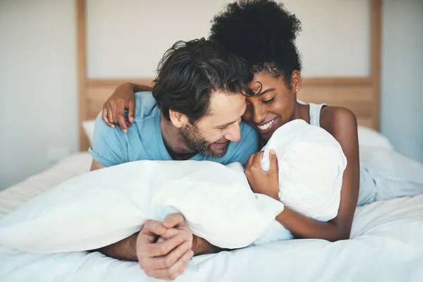 Fun Interracial Couple Laughing Bonding Lying Bed Home Bedroom Looking — Stockfoto