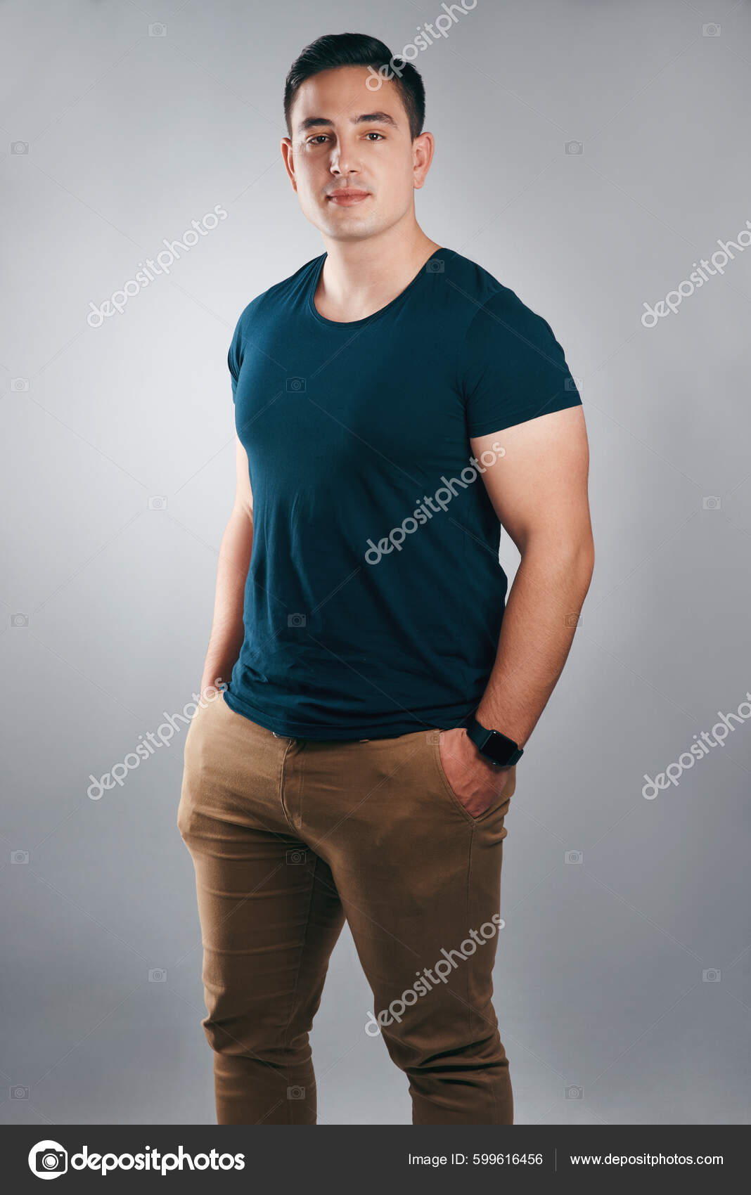 A person smiling confidently, wearing simple, elegant clothing