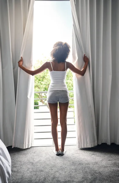 Lets Start Day Rearview Young Woman Opening Curtains Her Bedroom — Stockfoto