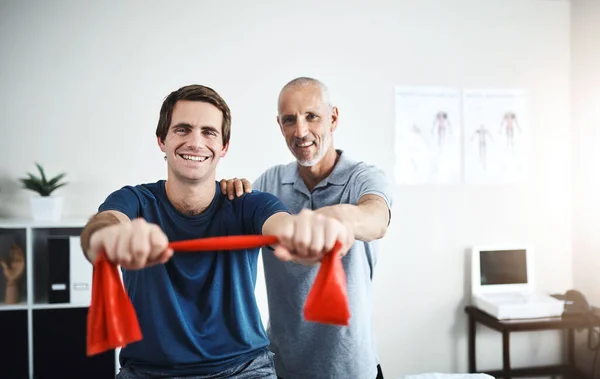 Feels Great Fully Mobile Again Portrait Physiotherapist Helping Patient Stretch — Stockfoto