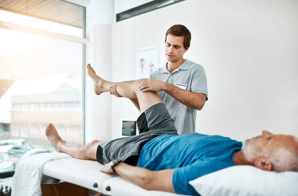 Just Relax Keep Still Young Male Physiotherapist Helping Client Leg — Stock Fotó