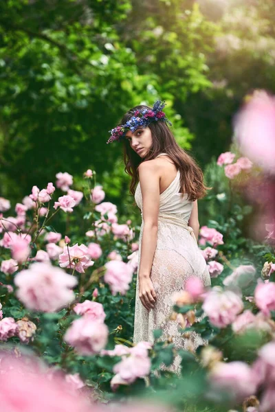 You are you and that is your power. a beautiful young woman wearing a floral head wreath posing in nature