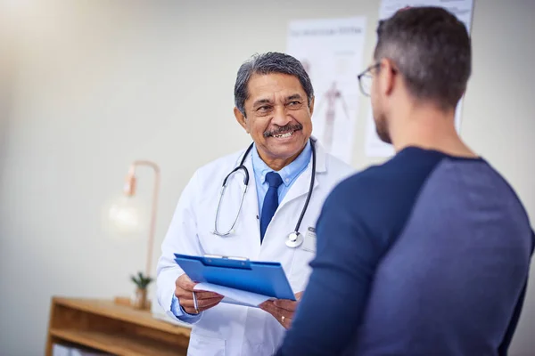 Youll Feeling Better Time Cheerful Mature Male Doctor Consulting Patient — Stockfoto