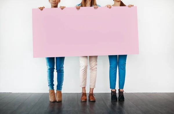 Something Ladies Cropped Studio Shot Group Young Women Holding Blank — Stockfoto