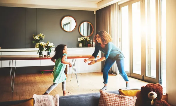 Im the first one she runs to. a young mother and her daughter spending quality time together at home