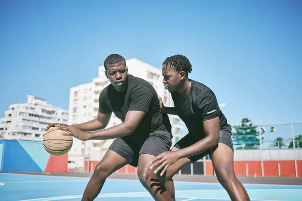 Basketball, fitness and active sports game played by young African men in an outdoor court for exercise. Training, workout and healthy guy friends playing a fun, friendly and athletic sport in summer.