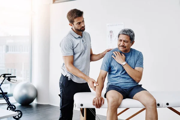 Lets See What Problem Here Young Male Physiotherapist Helping Mature — Stock Photo, Image