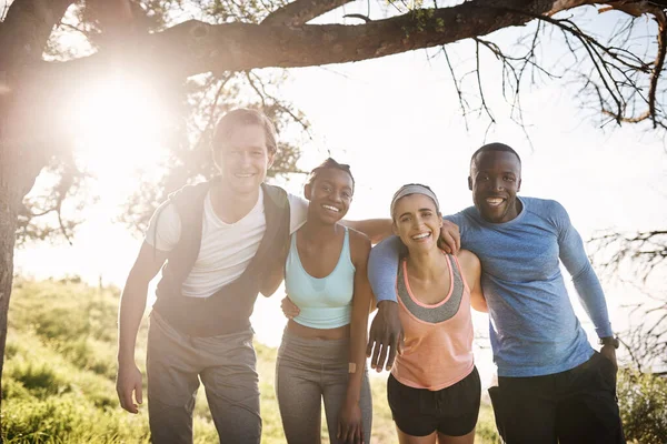 Our friendship gets better with every run. Portrait of a group of friends out exercising together