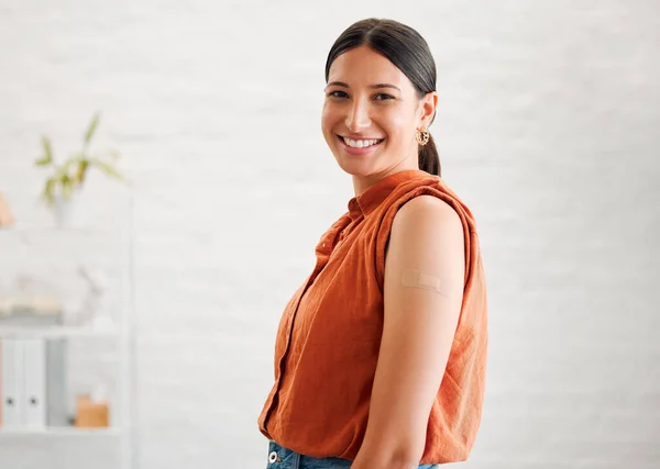 Smiling, happy and motivated female entrepreneur showing great leadership in a creative office with copy space. Portrait of confident and proud entrepreneur satisfied with job in a startup business.