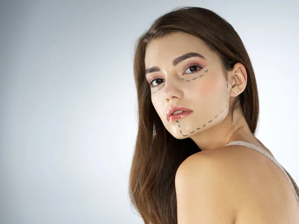 Enhancing Her Beauty Studio Shot Beautiful Young Woman Posing Gray —  Fotos de Stock