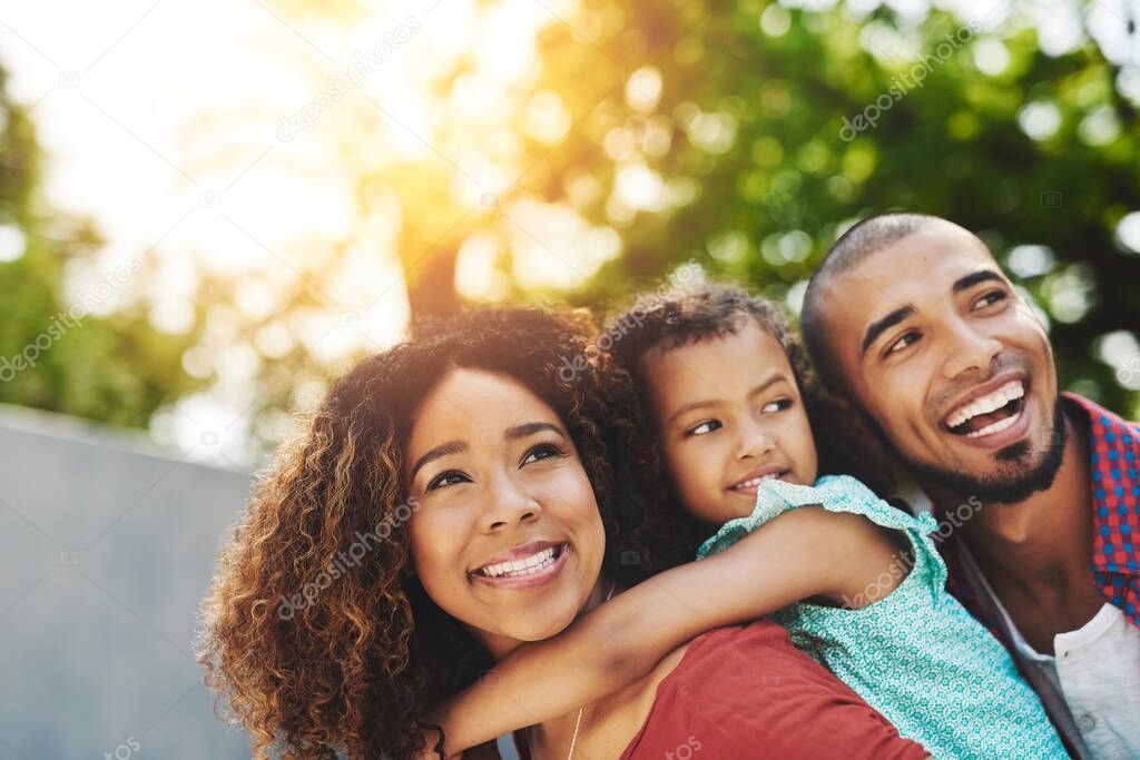 Family love, the truest love. a happy little girl and her parents having fun in their backyard