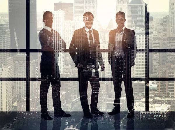 When your style matches your ambition. Portrait of a stylishly dressed young businessmen superimposed over a cityscape