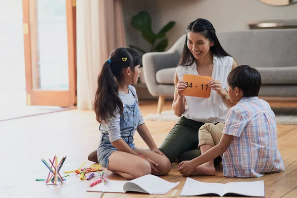 Think Hard Carefully Cheerful Mother Her Two Children Doing Homework — Photo