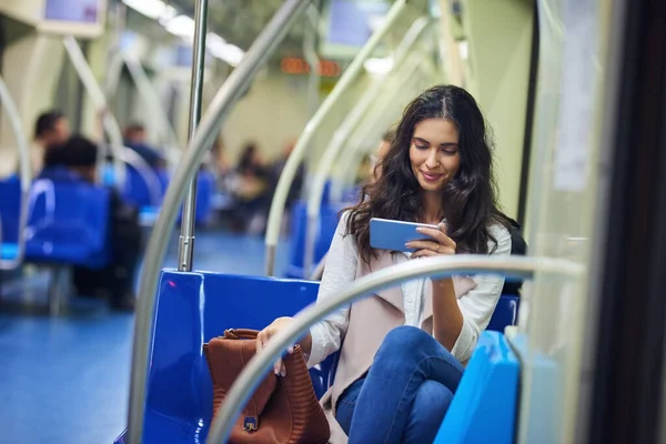 Staying Entertained While Commuting Young Attractive Woman Using Cellphone While — Stockfoto