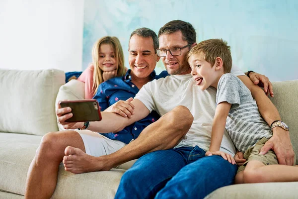 Family Fun Affectionate Family Four Taking Selfies Sofa Home — 图库照片