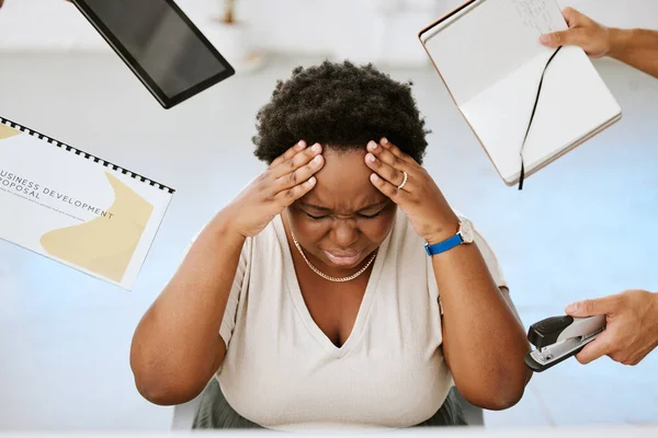 Stressed, depressed and frustrated black entrepreneur with overworked, suffer from burnout, anxiety and headache. Business woman struggle with work overload chaos, fail to meet deadlines