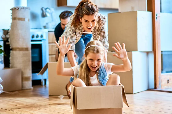 Time Adventure Cheerful Young Woman Pushing Her Daughter Box Imagining — Stockfoto