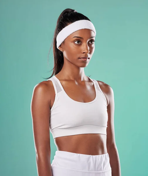 Black female tennis, badminton or squash player standing, relax and cool before competition, tournament and game or match. Athletic and fit African American sports woman with professional sportswear.