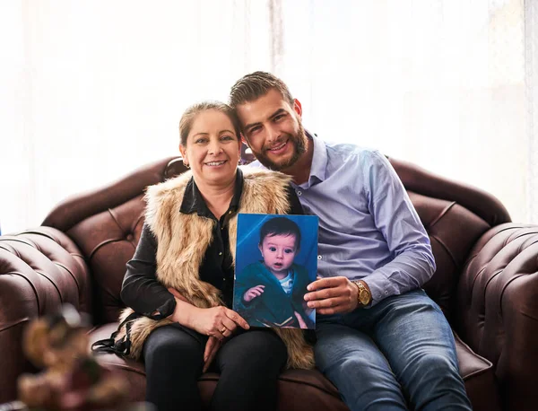Proud Who Son Has Become Mother Son Holding Old Photograph — Photo