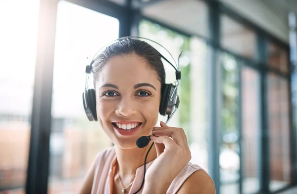 Thank you for calling our company. Cropped portrait of an attractive young woman working in a call center