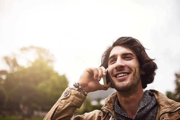 Glad Its You Cheerful Young Man Talking His Phone While — Stockfoto