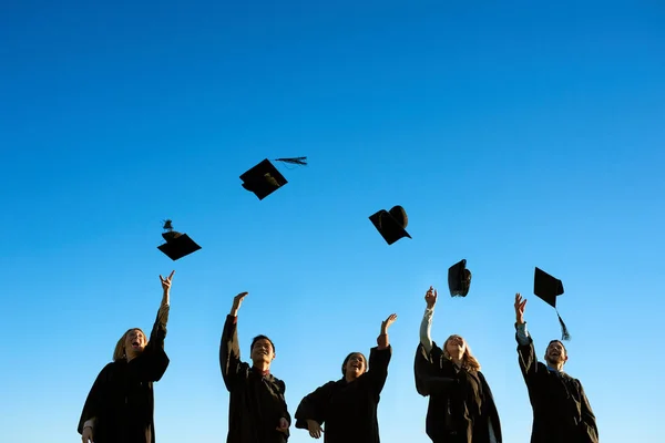 Sharing Celebrations Glorious Day Group Students Throwing Hats Air Graduation — Zdjęcie stockowe
