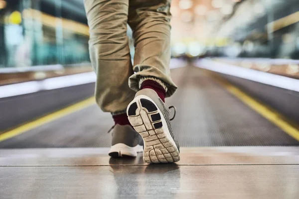 Book that ticket and just go. an unrecognizable woman walking indoors 0