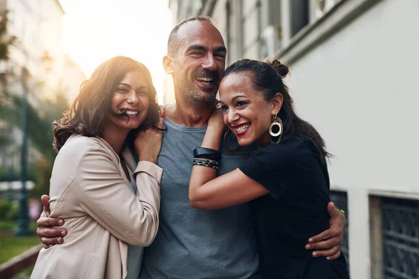 Friends are everything. three friends having fun while out in the city