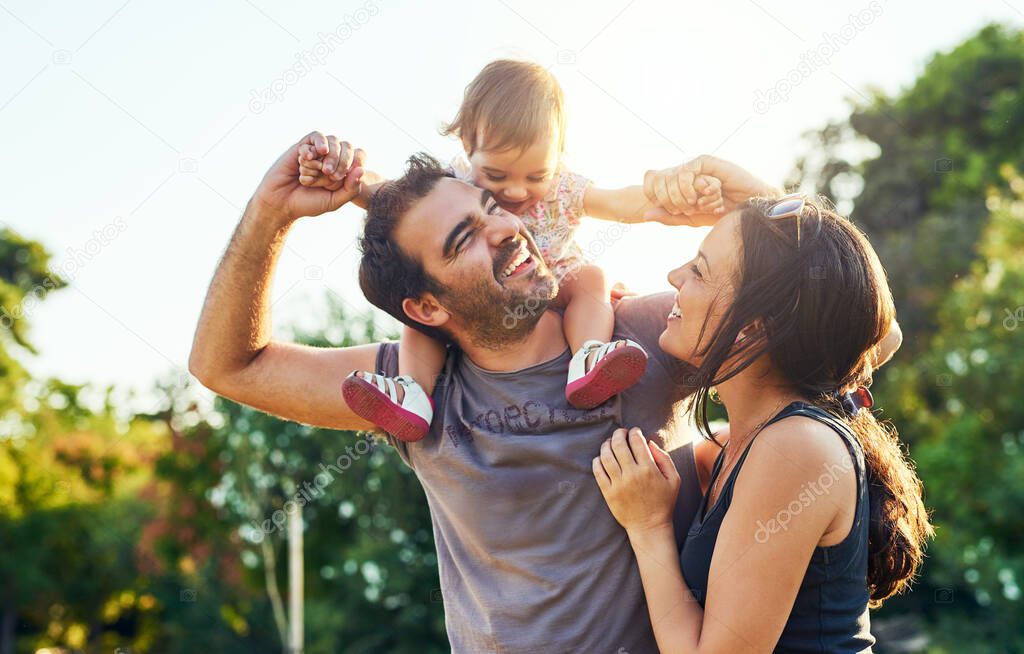 We always enjoy family bonding time. a young family outdoors