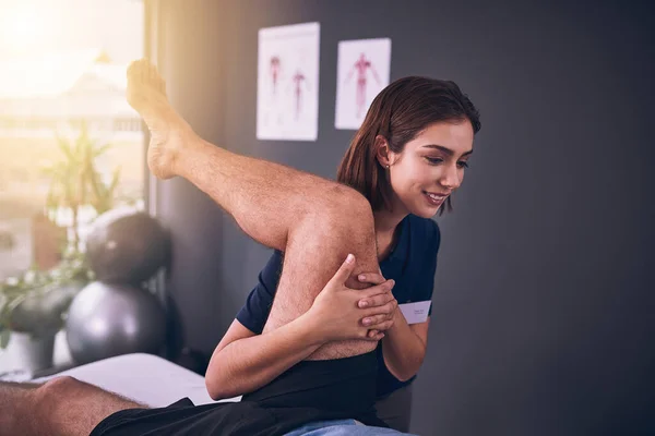 Just Little Further Young Female Physiotherapist Treating Mature Male Patient — Foto de Stock